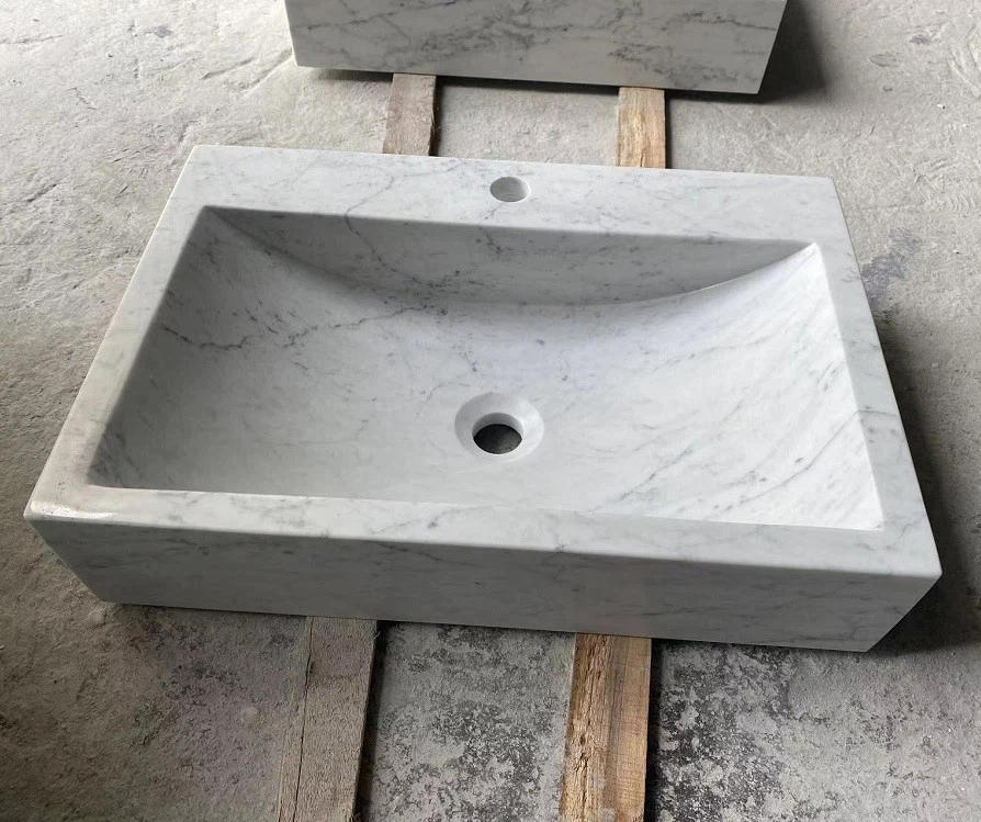 White marble sinks with different shapes White marble sinks with different shapes