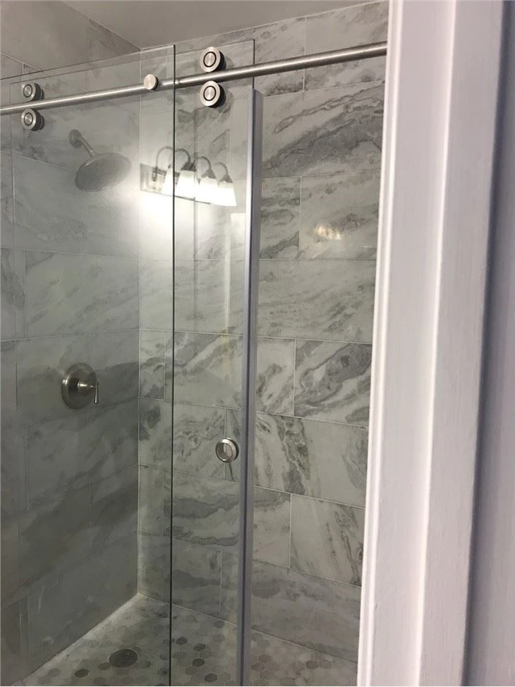 Sahara Carrara marble tile bathroom